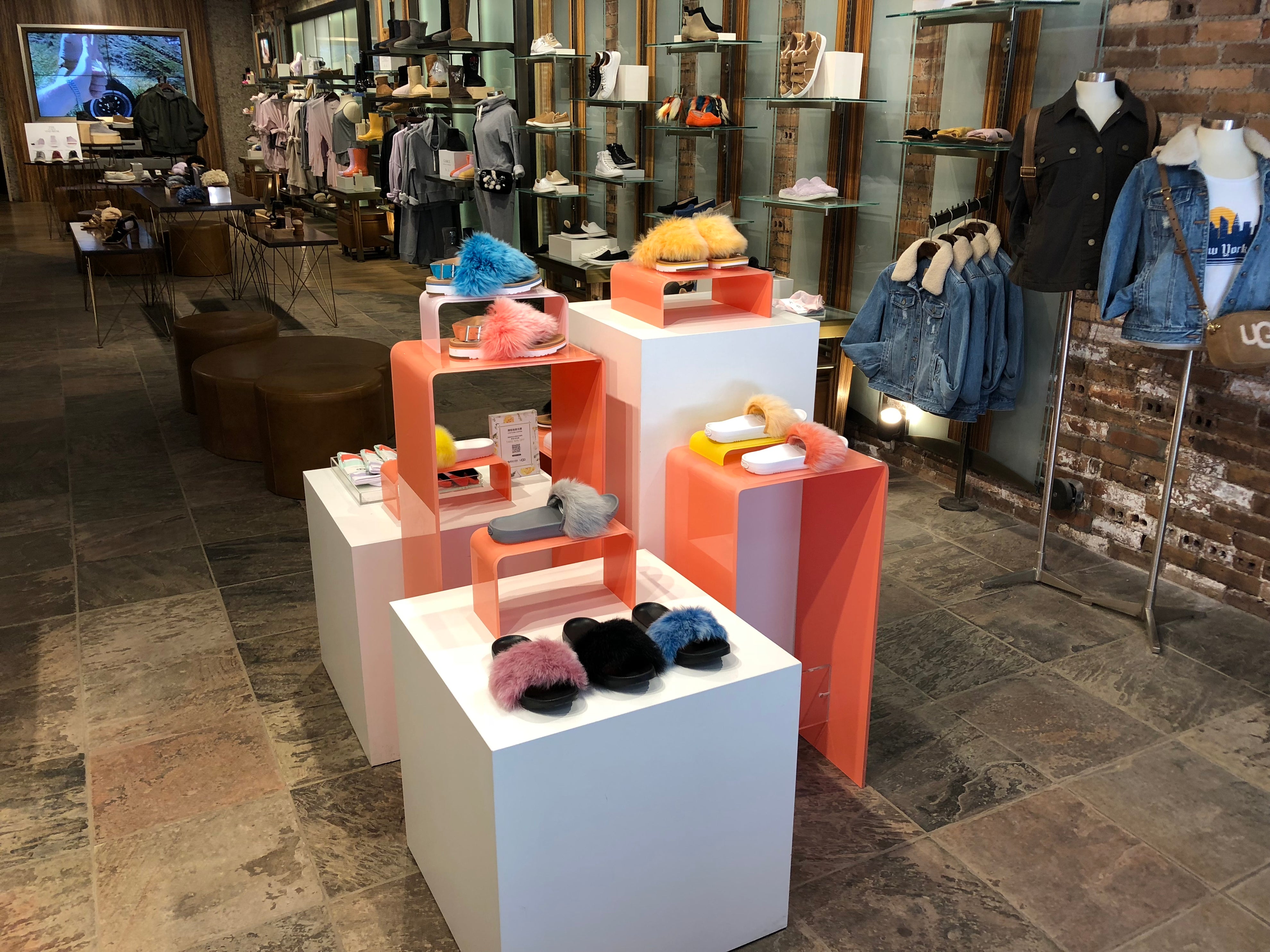 White Pedestals and Colored Acrylic Risers for Ugg Retail Stores